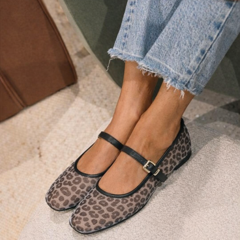 Women's black leopard strap flats worn with cropped jeans | SAVINTARI